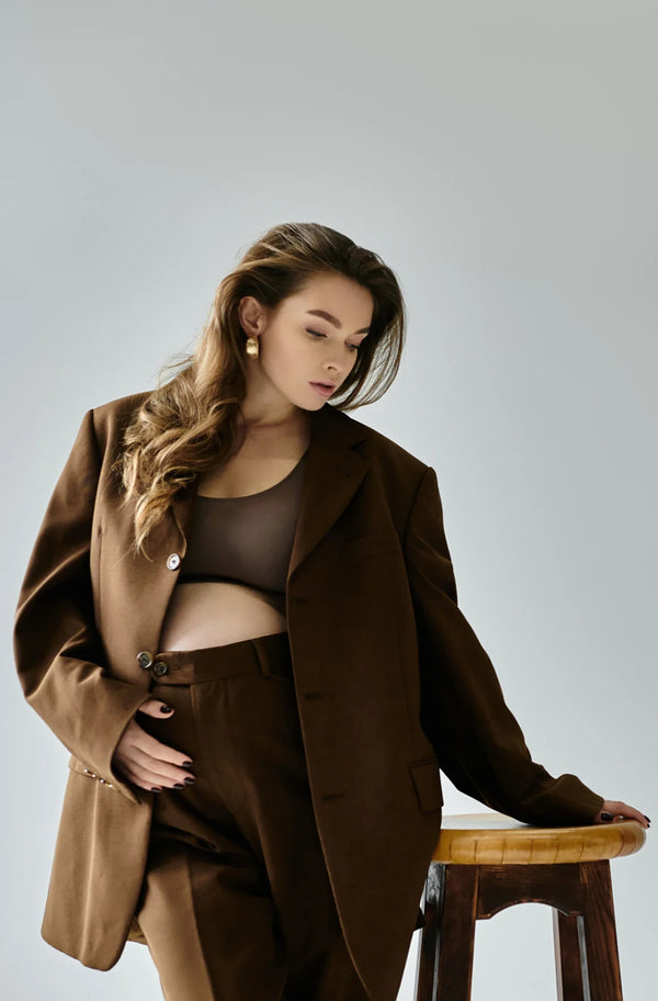 Model wearing a chocolate brown blazer and matching trouser co-ord set